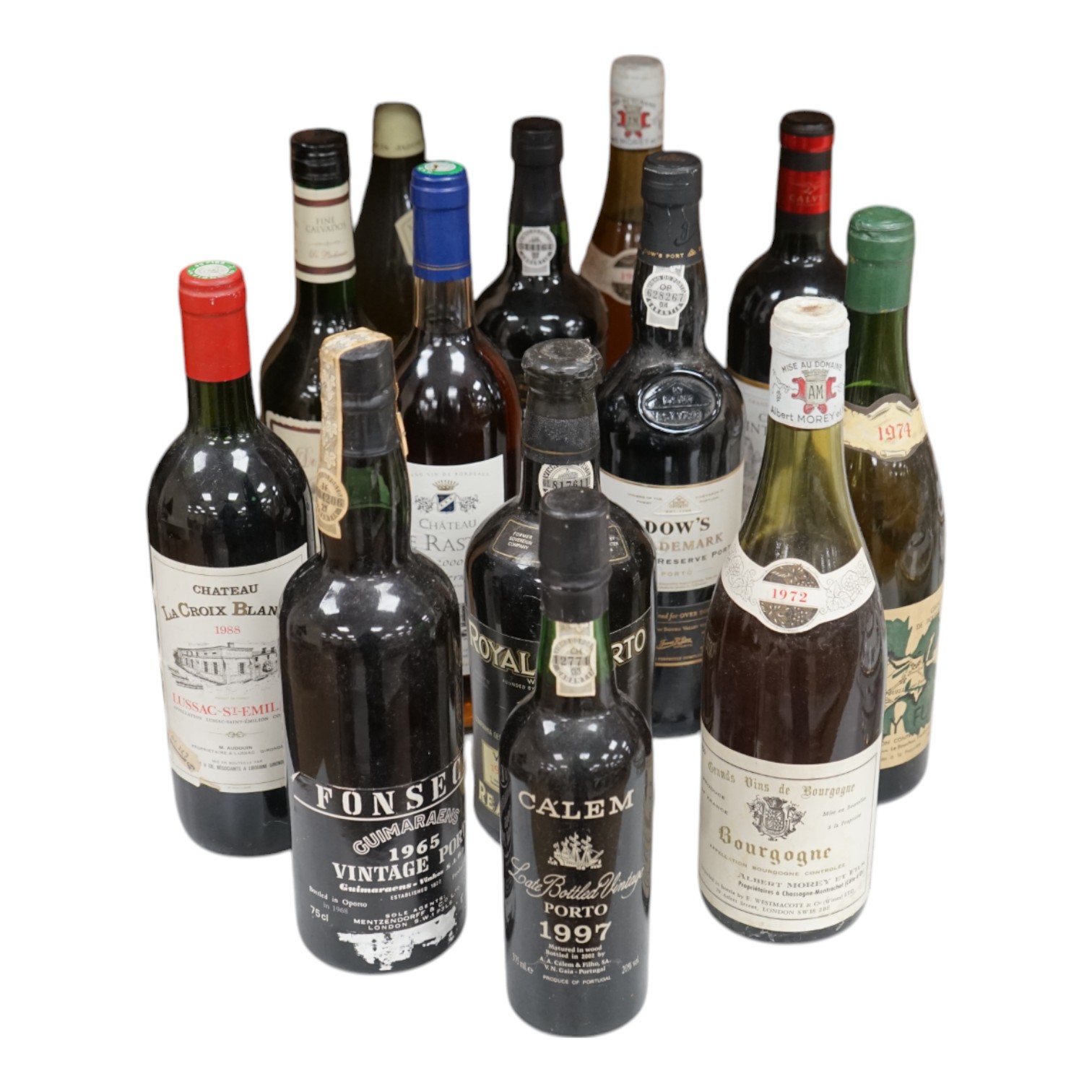 Seven bottles of mixed wines including St Emilion, Sauternes, Bordeaux, together with five bottles of mixed ports including Dow’s and two bottles of Fonseca port and a bottle of Calvados. Condition - unknown storage.